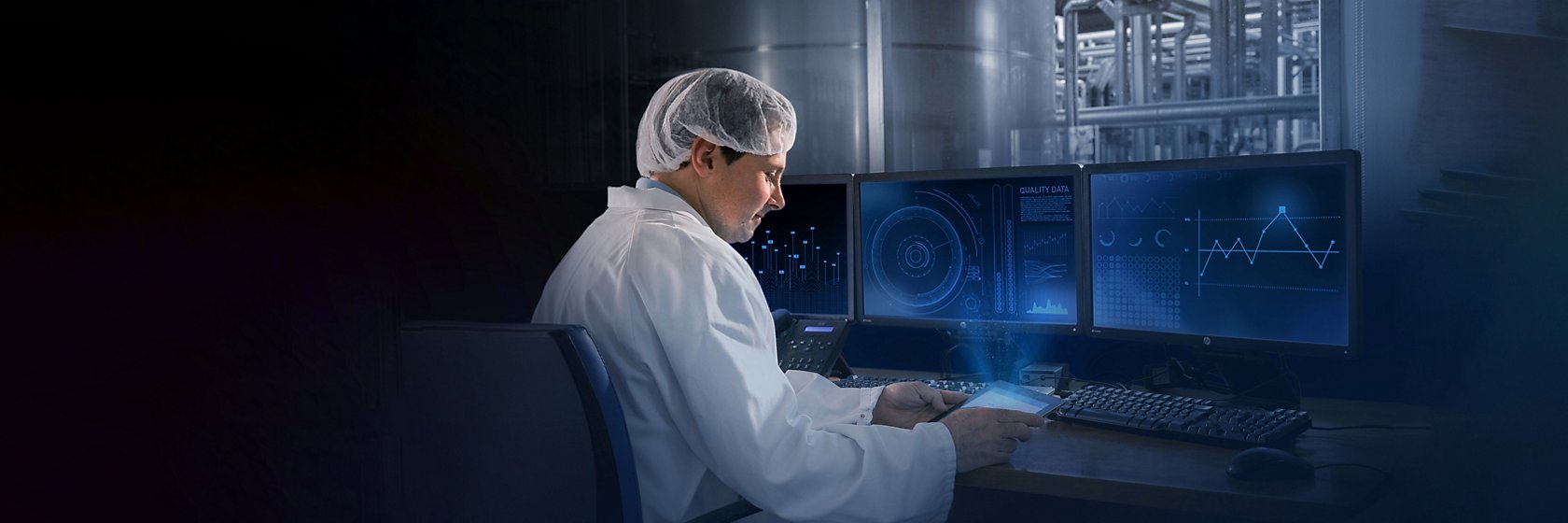 Operator in front of screens