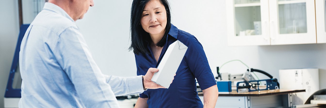 Two people and carton packaging